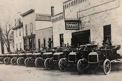 Early car dealerships introduced the revolutionary concept of buying vehicles close to home.